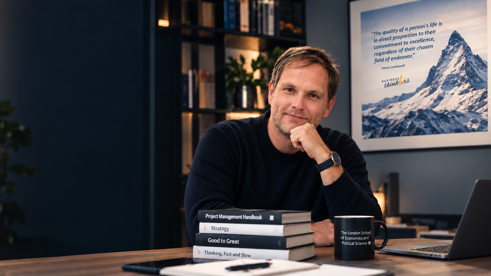Sami Suominen seated at a desk with business books.